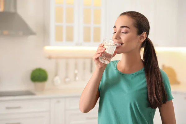 Young Woman Drinking Pure Water Glass Kitchen Space Text — Stock Photo, Image