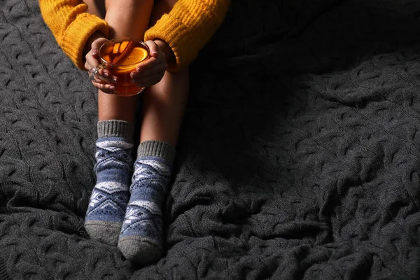 Woman Warm Socks Cup Tea Resting Knitted Blanket Closeup Space — Stock Photo, Image