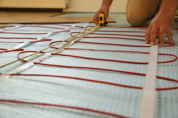 Professional Worker Installing Electric Underfloor Heating System Indoors Closeup — Stock Photo, Image