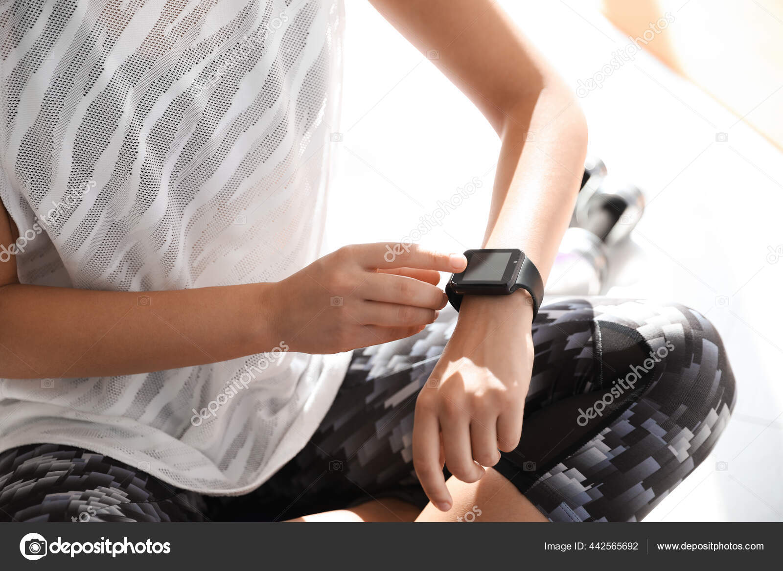 Woman Checking Fitness Tracker Gym Closeup Stock Photo by ©NewAfrica
