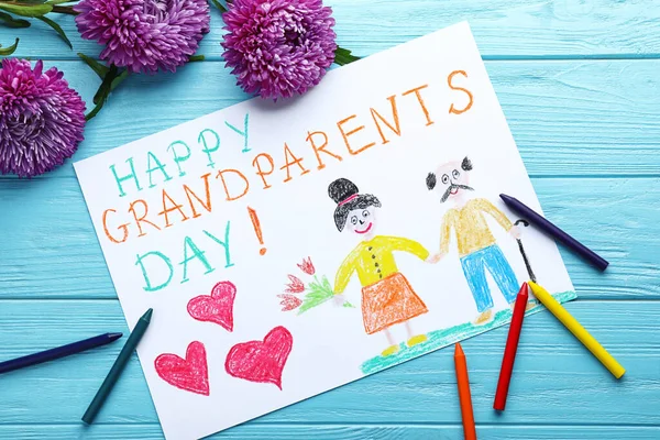 美丽的图画 上面有一句话 祖父母快乐日 放在蓝色的木制桌子上 平铺着 — 图库照片