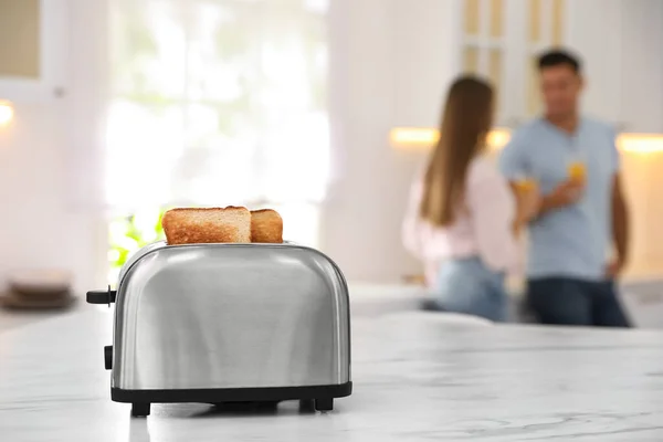 Modern Toaster Slices Bread Blurred Couple Background — Stock Photo, Image