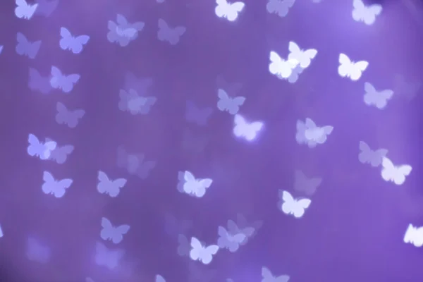 Όμορφη Πεταλούδα Σχήμα Φώτα Μωβ Φόντο — Φωτογραφία Αρχείου