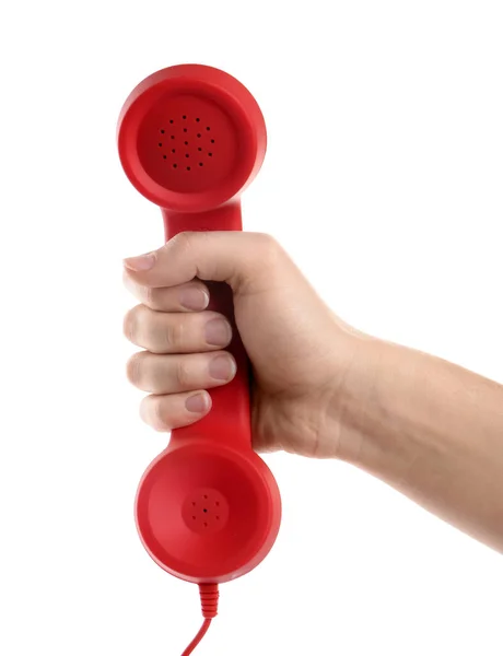 女性手持红色绳状手机 背景为白色 热线电话的概念 — 图库照片