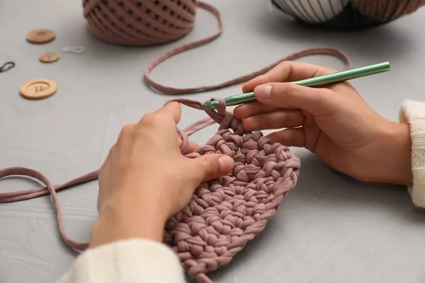 Woman Crocheting Threads Grey Table Closeup Engaging Hobby — Stock Photo, Image