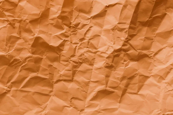 背景としてのオレンジの折りたたみ紙の質感 トップビュー — ストック写真