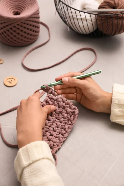 Woman Crocheting Threads Grey Table Closeup Engaging Hobby — Stock Photo, Image