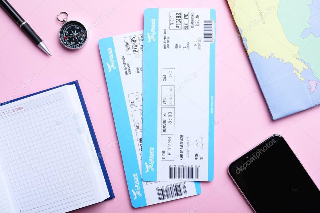 Flat lay composition with tickets on pink background. Travel agency concept