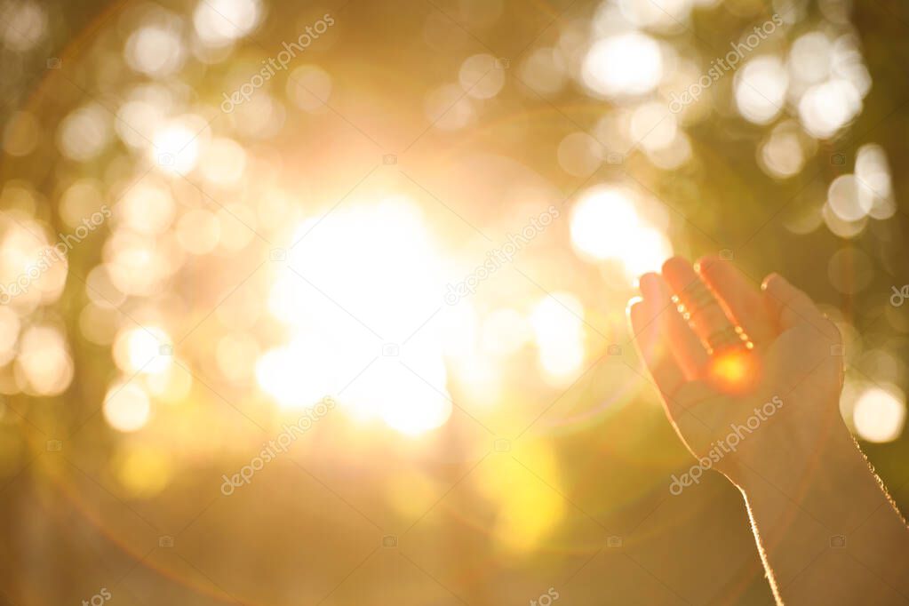 Young woman enjoying beautiful sunset, closeup view with space for text. Nature healing power