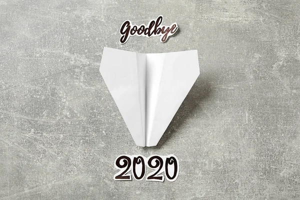 Text Goodbye 2020 Paper Plane Grey Background Flat Lay — Stock Photo, Image