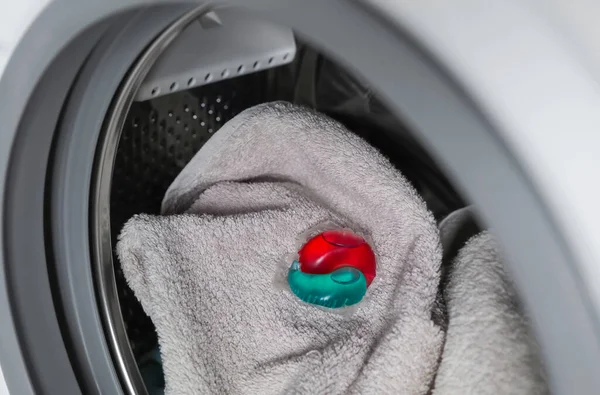 Laundry Detergent Capsule Towel Washing Machine Drum Closeup View — Stock Photo, Image