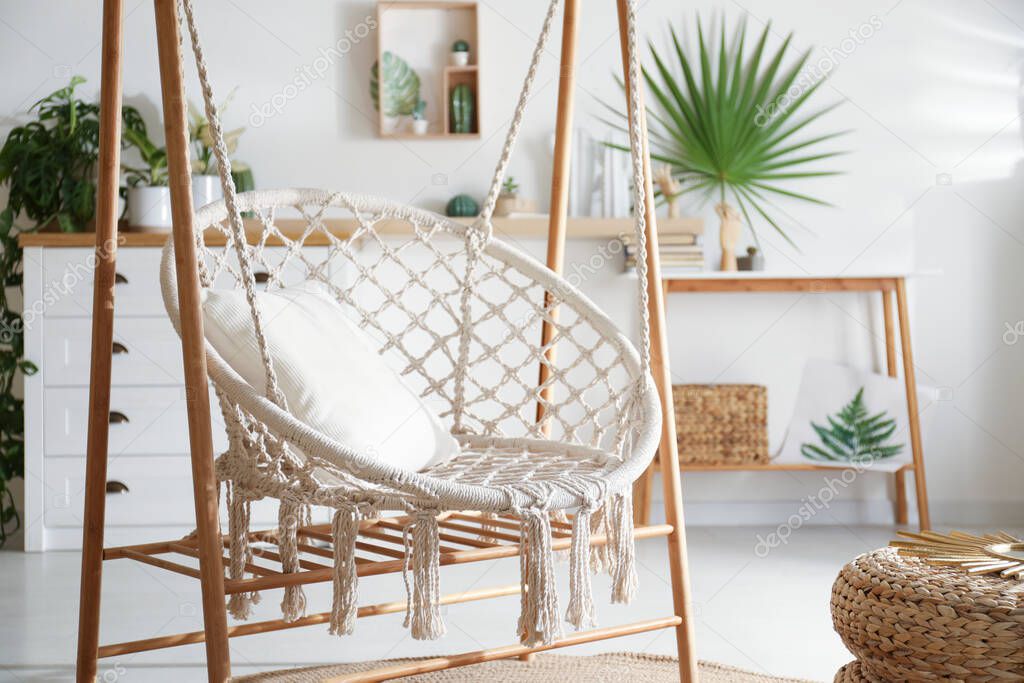Comfortable hammock chair in stylish room. Interior design