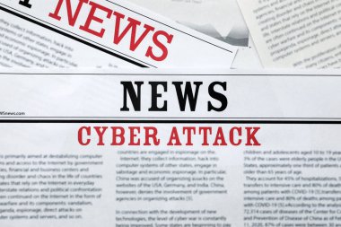 Newspapers with headline Cyber Attack as background, closeup clipart