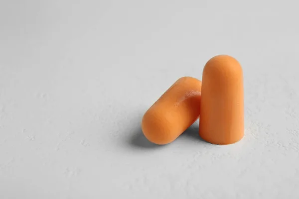 Pair Orange Ear Plugs Grey Background Closeup Space Text — Stock Photo, Image