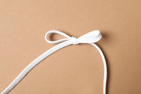 White Shoelace Brown Background Top View — Stock Photo, Image