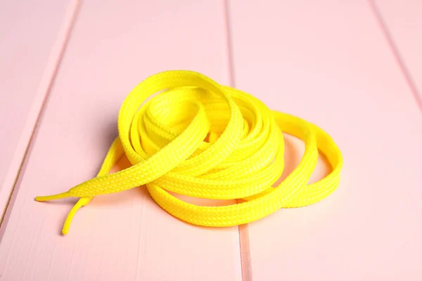 Yellow Shoelace Pink Wooden Background Stylish Accessory — Stock Photo, Image