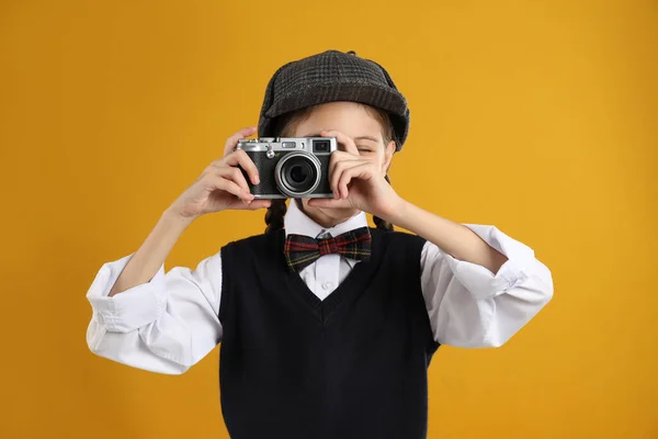 Cute Little Detective Taking Photo Vintage Camera Yellow Background — Stock Photo, Image