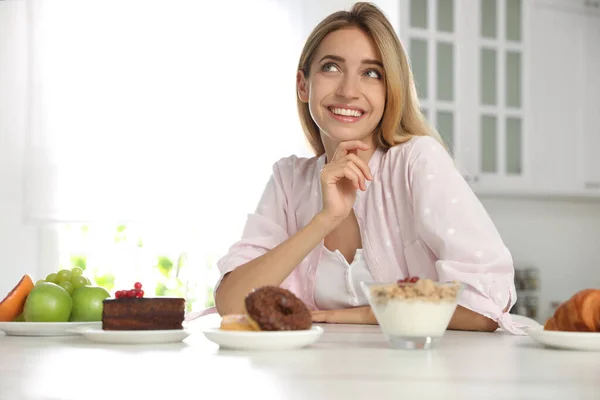 Woman Choosing Sweets Healthy Food White Table Kitchen Stock Picture