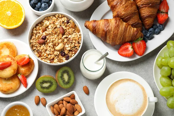 Buffet service. Tasty breakfast served on light grey table, flat lay