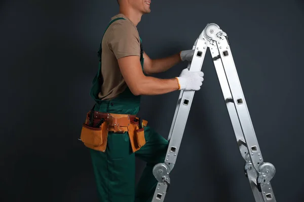 Professional Constructor Climbing Ladder Black Background Closeup — Stock Photo, Image