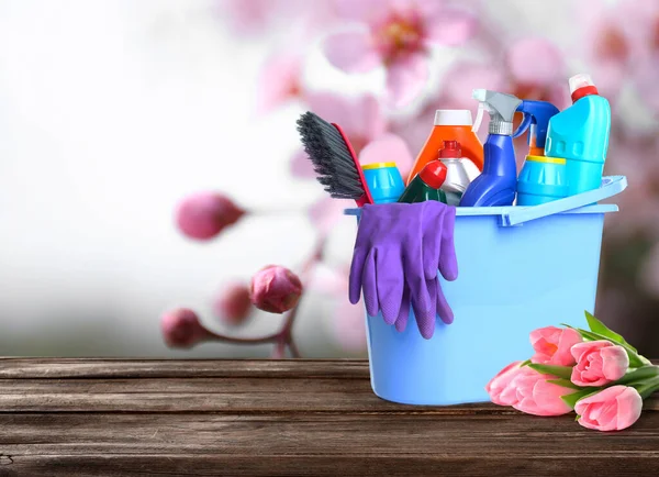 Different Cleaning Supplies Spring Flowers Wooden Table Outdoors Space Text — Stock Photo, Image
