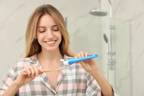 Woman Applying Toothpaste Brush Bathroom — Stock Photo, Image