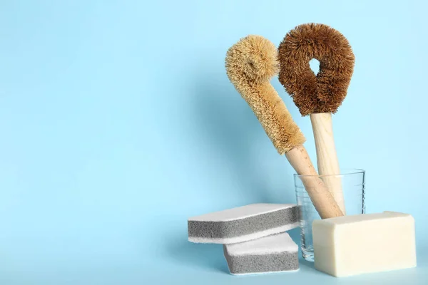 Cleaning Brushes Sponges Soap Bar Light Blue Background Space Text — Fotografia de Stock