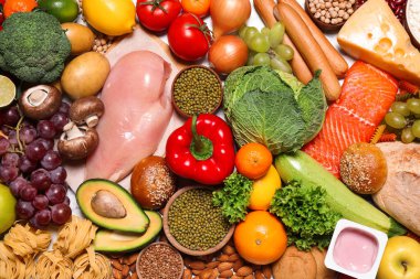 Arka plan olarak farklı ürünler, üst görünüm. Sağlıklı yiyecekler ve dengeli beslenme