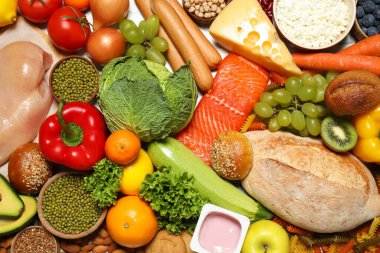 Arka plan olarak farklı ürünler, üst görünüm. Sağlıklı yiyecekler ve dengeli beslenme