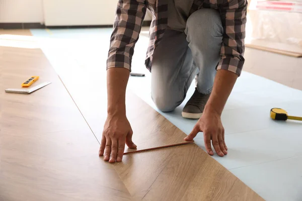 Worker Installing Laminated Wooden Floor Indoors Closeup — Stock Photo, Image