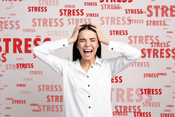 Stressed young woman and text on light background