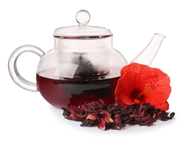 Freshly brewed hibiscus tea and dry flowers on white background
