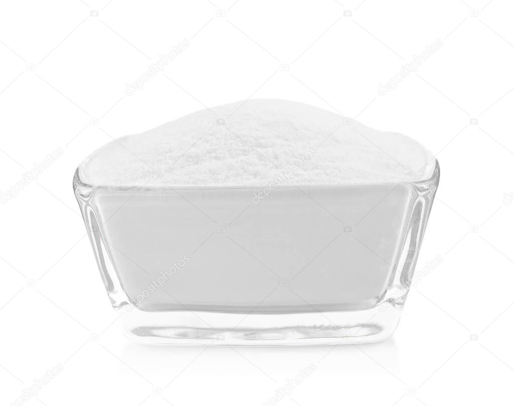 Glass bowl with baking soda isolated on white