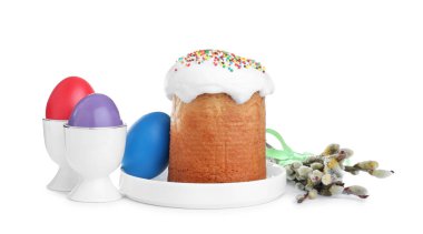 Traditional Easter cake, pussy willows and colorful eggs on white background