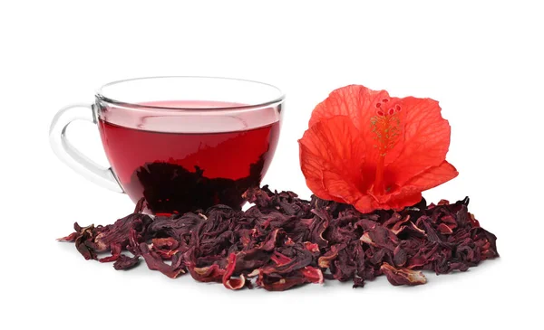Delicious hibiscus tea and dry flowers on white background