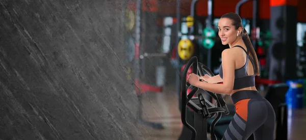 Woman using modern elliptical machine in gym, space for text. Banner design