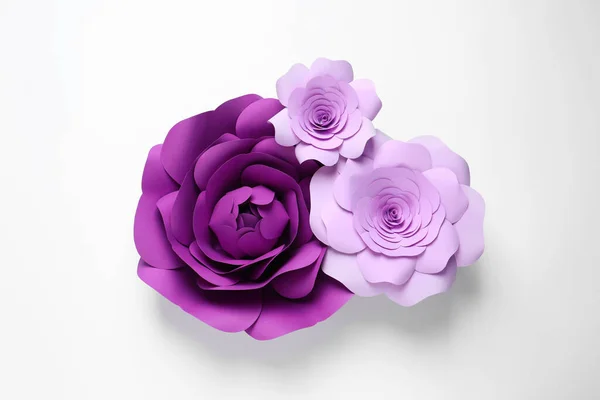 Different beautiful flowers of paper on white background, top view