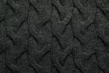 Arka plan olarak örülmüş gri yün kumaş, üst görünüm