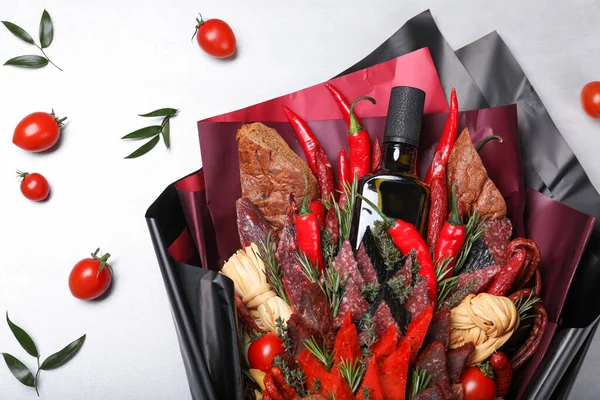 Beautiful food bouquet on light background, flat lay