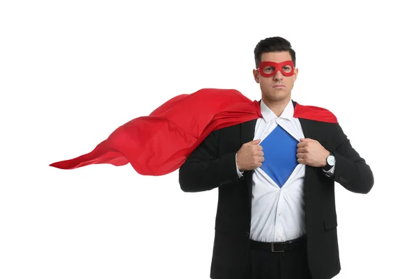 Businessman in superhero cape and mask taking suit off on white background