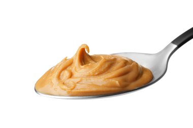 Beyaz kaşık içinde lezzetli fıstık ezmesi.