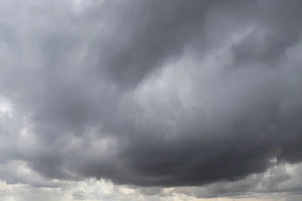 Sky with heavy rainy clouds on grey day