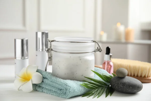 Composition with salt scrub on white table