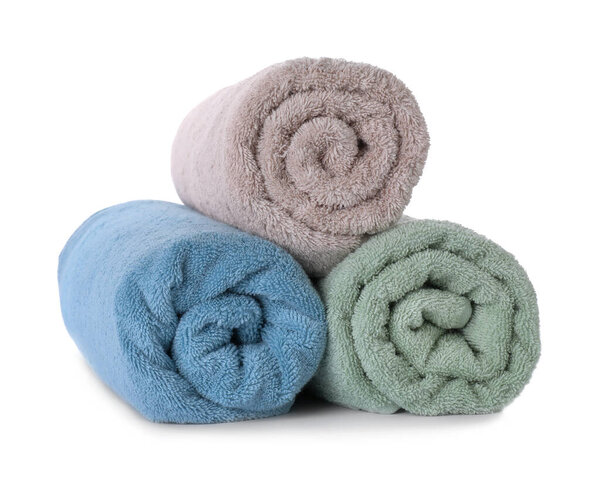Rolled fresh clean towels on white background