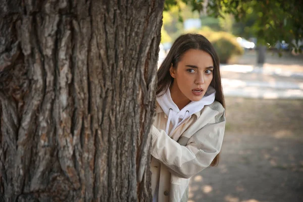 Jealous woman spying on ex boyfriend in park