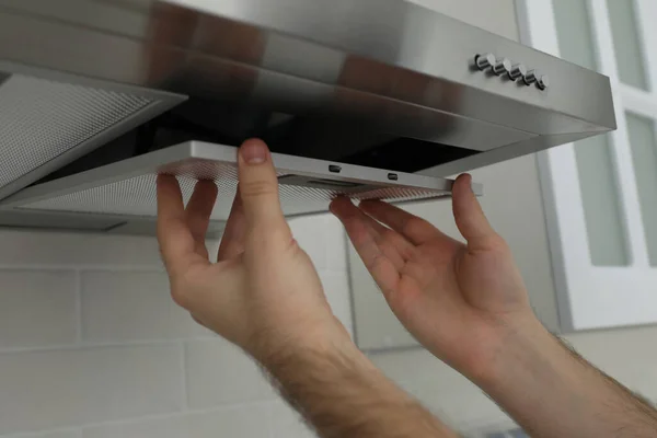 Worker Repairing Modern Cooker Hood Indoors Closeup — Stock Photo, Image