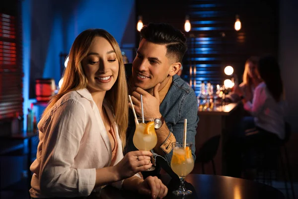 Man and woman flirting with each other in bar