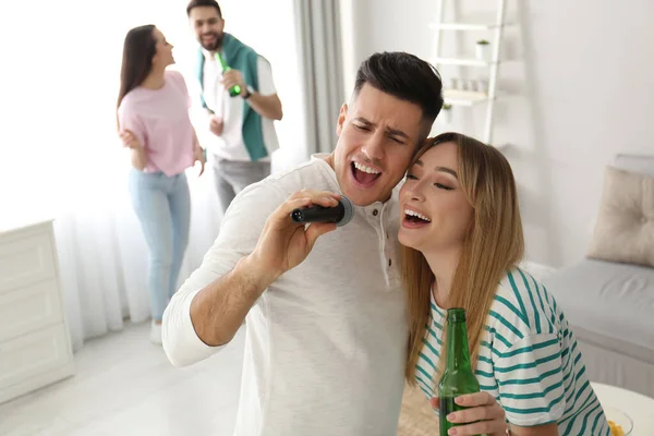 Happy Couple Singing Karaoke Friends Home — Stock Photo, Image