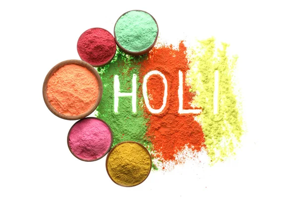 Kleurrijke Poeders Met Woord Holi Witte Achtergrond Bovenaanzicht — Stockfoto