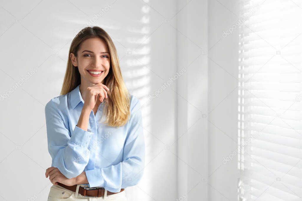 Portrait of beautiful young businesswoman in office